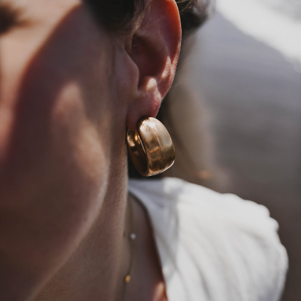 
                      
                        Pyrgos | Boucles d'oreilles / Créoles en acier inoxydable | Doré
                      
                    