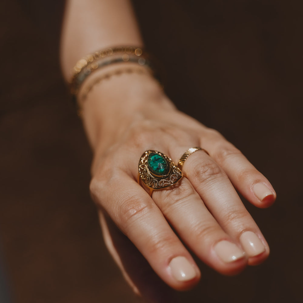 
                      
                        Bague acier inoxydable et pierre naturelle Turquoise Africaine - Louxor - Doré
                      
                    