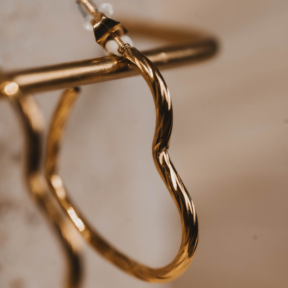 
                      
                        Fira | Boucles d'oreilles / créoles en acier inoxydable | Doré
                      
                    